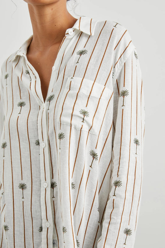 White linen blend shirt with classic collar and button through with brown vertical stripes and palm trees