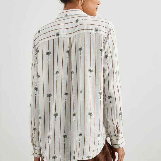 White linen blend shirt with classic collar and button through with brown vertical stripes and palm trees