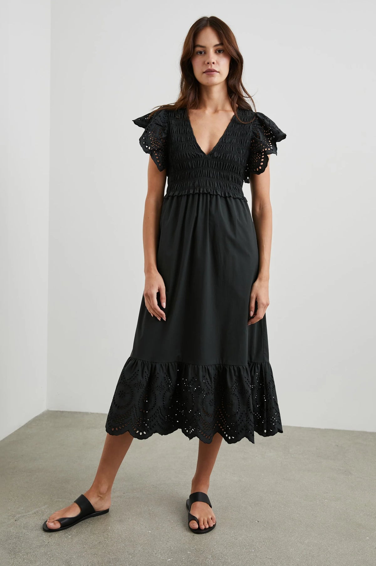 Black midi dress with eyelet features and ruched V neck bodice