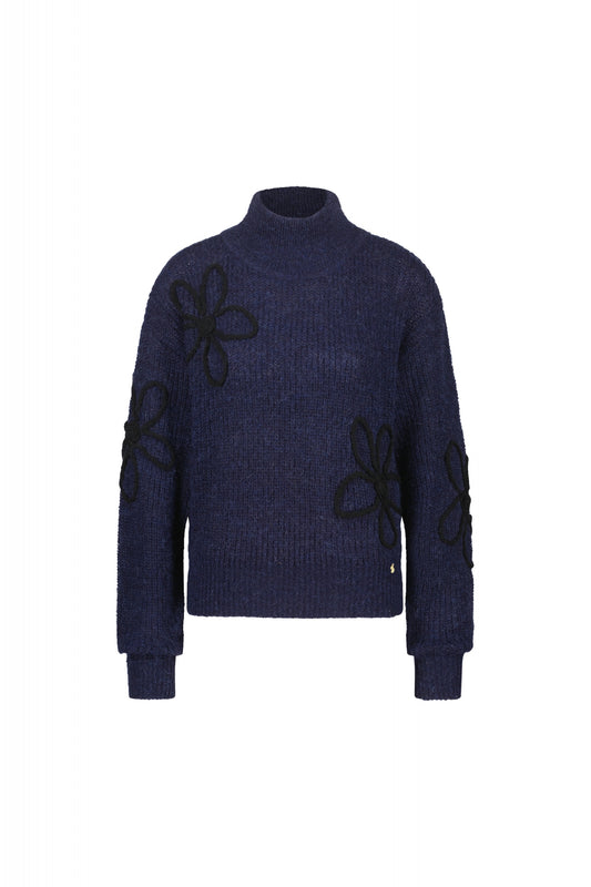 Navy turtleneck jumper with black knitted floral details