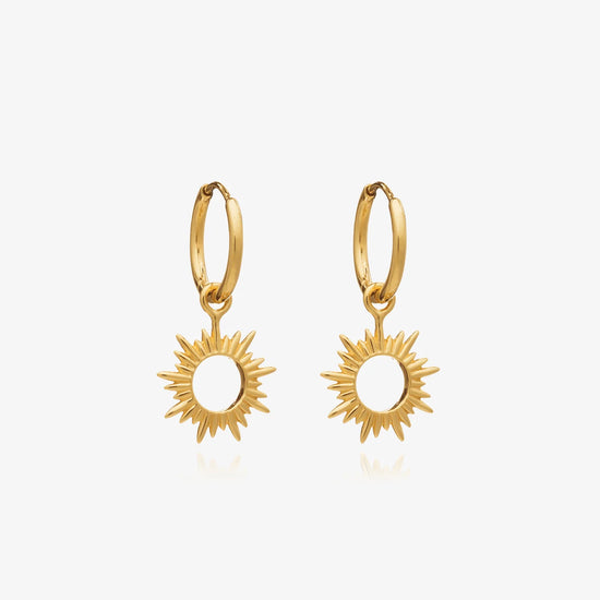 small gold huggie hoop earrings with spiky sunshine charms from rachel jackson