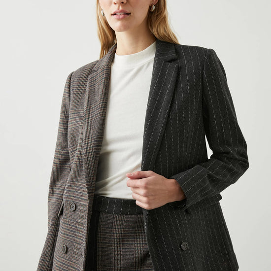 Contrast jacket with one side check design and the other pinstripe 