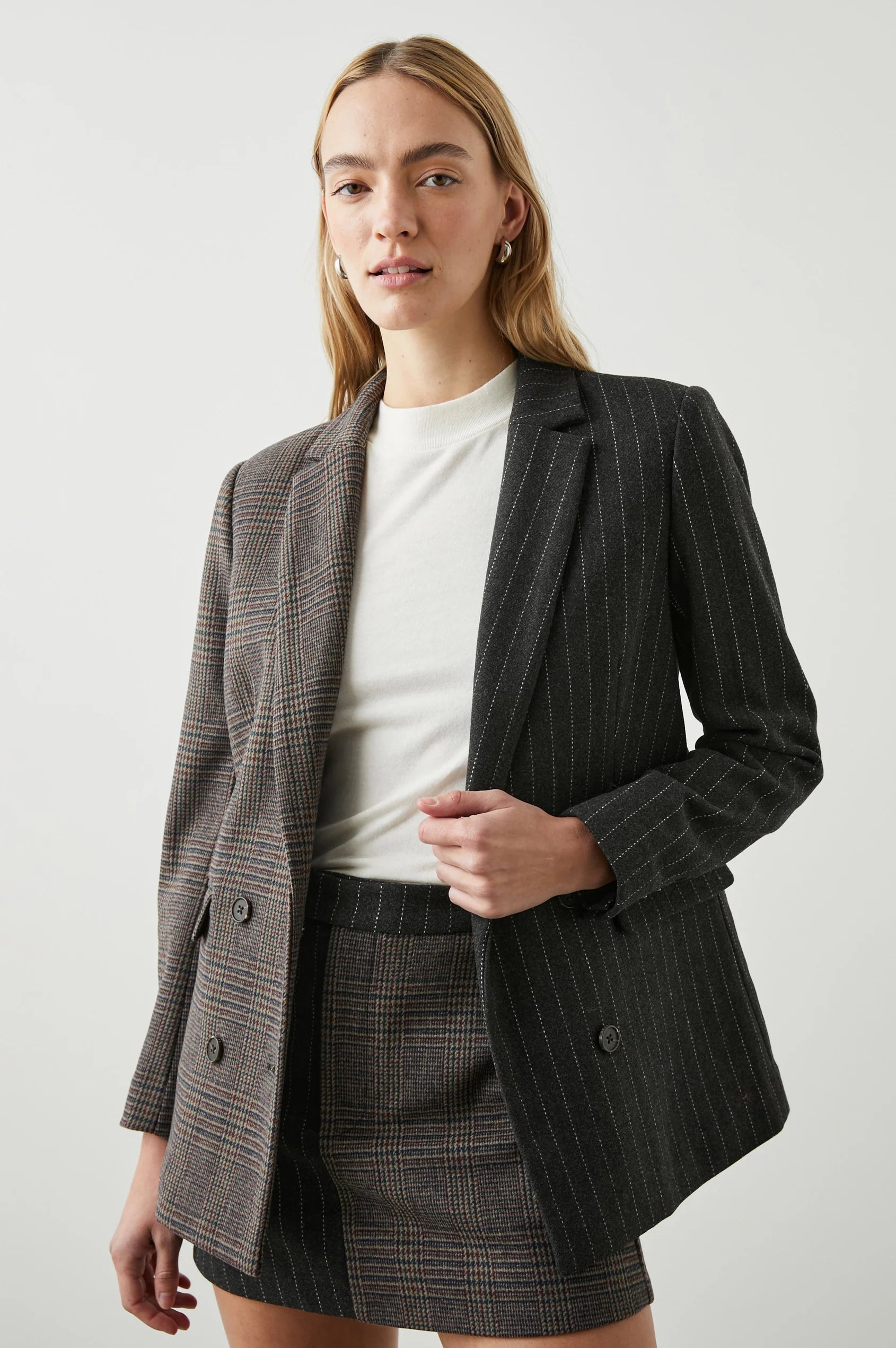 Contrast jacket with one side check design and the other pinstripe 