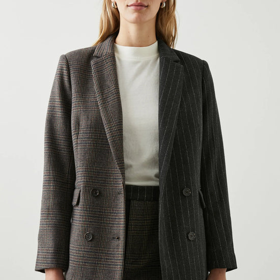 Contrast jacket with one side check design and the other pinstripe 