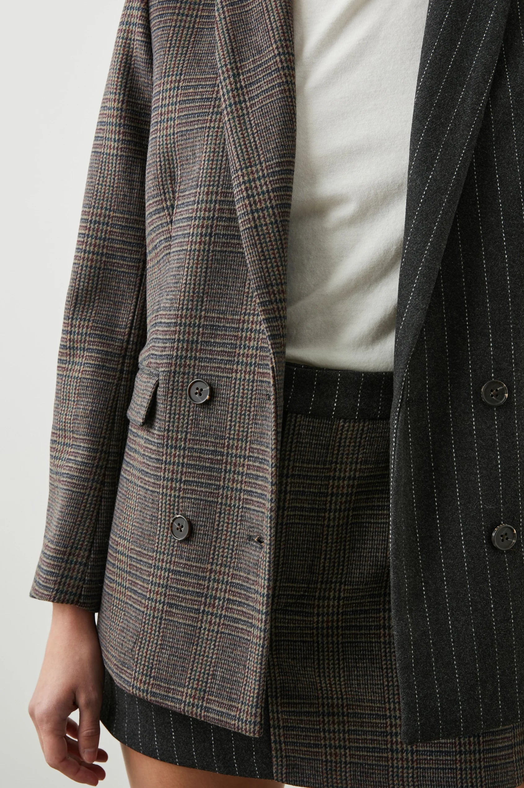 Contrast jacket with one side check design and the other pinstripe 