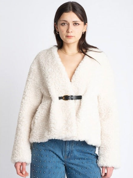 white faux fur cropped jacket with black buckle fastening and v neck  model shot 