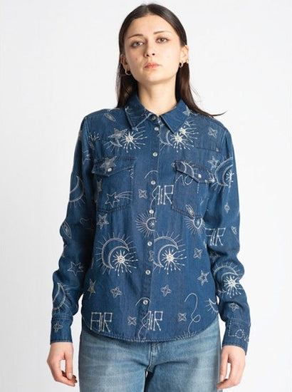 Front view of blue shirt detailing embroidered pattern.