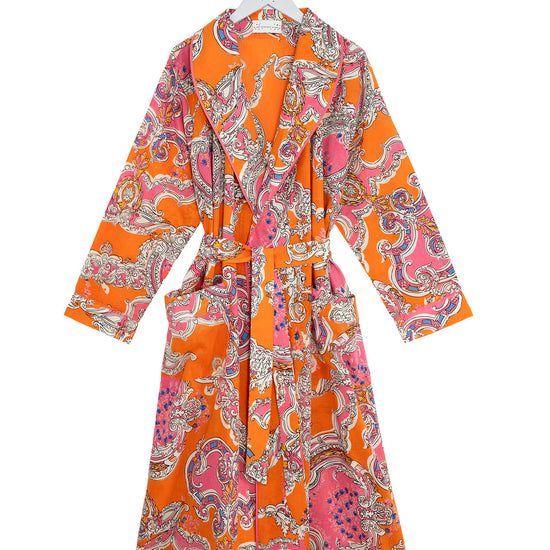 Orange patterned dress on a white background