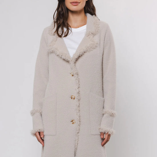 knitted long cardigan with frayed edge and 2 front pockets 