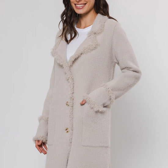 knitted long cardigan with frayed edge and 2 front pockets 