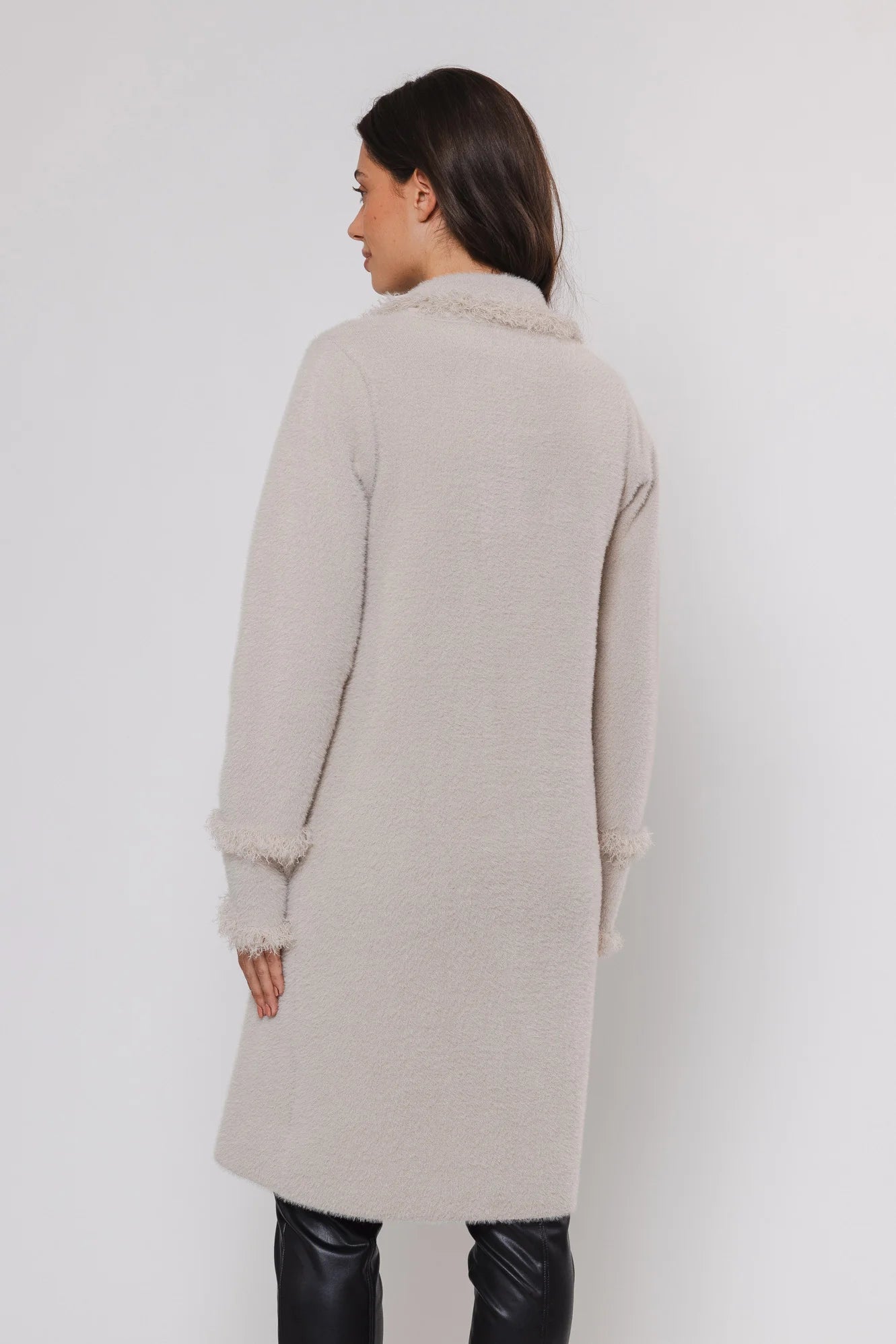 knitted long cardigan with frayed edge and 2 front pockets rear view