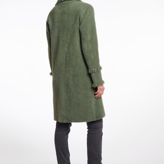 green fluffy long cardigan which comes just above the knee with fringe detailing patch pockets and long sleeves rear view 