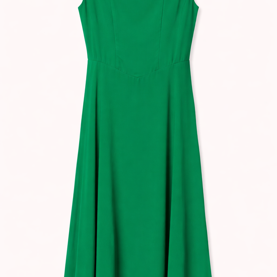 Green dress with thin straps on a white background.