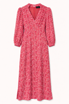 Pink floral dress with long sleeves on a white background
