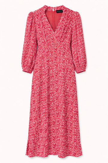 Pink floral dress with long sleeves on a white background