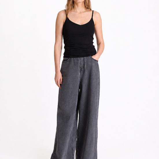 black spaghetti strap top with v neck
worn with grey denim