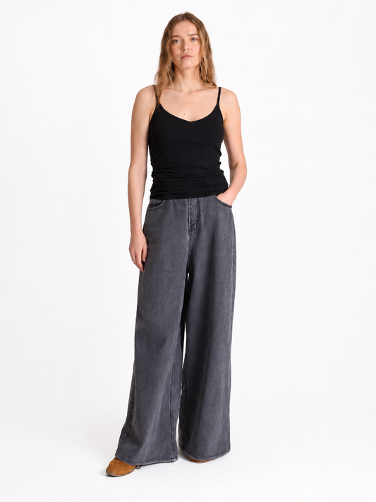 black spaghetti strap top with v neck
worn with grey denim