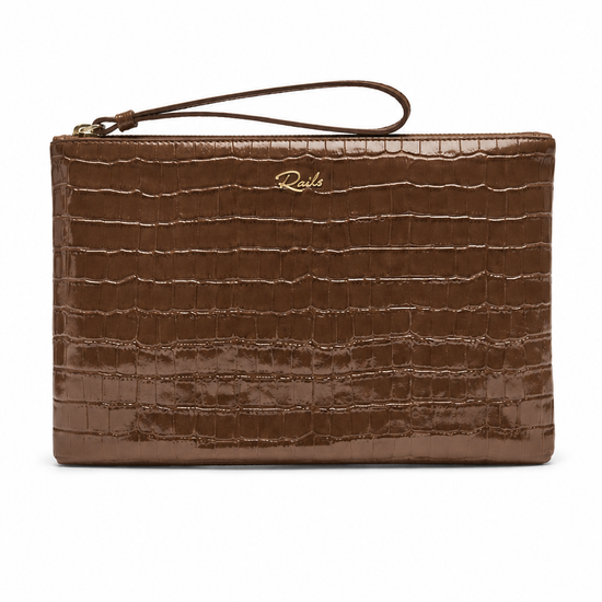 A brown crocodile-embossed leather clutch bag with a wristlet strap and a small gold 'Ricks' logo on the front, set against a plain white background.
