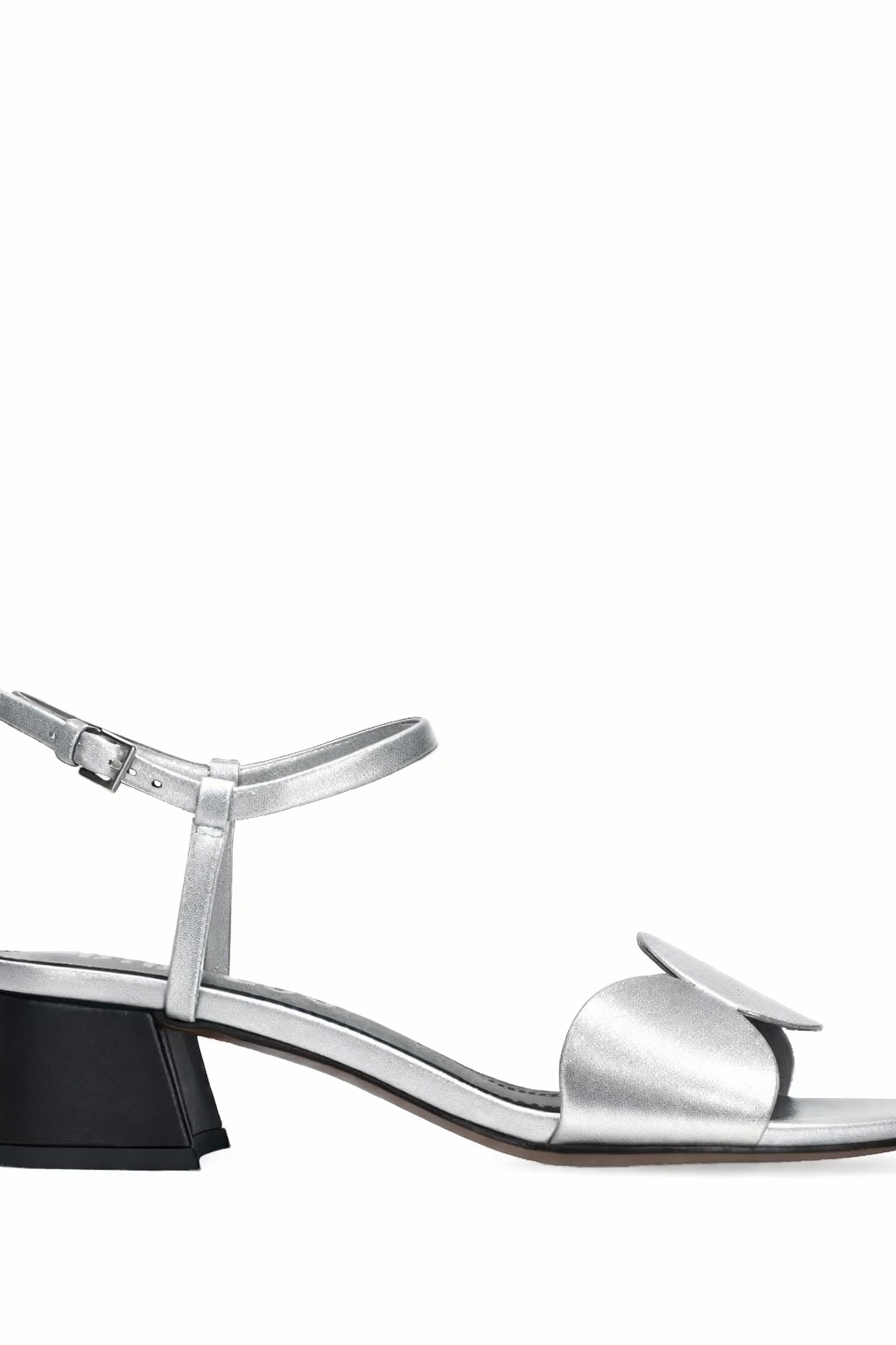 Silver sandal with a black heel on a white background