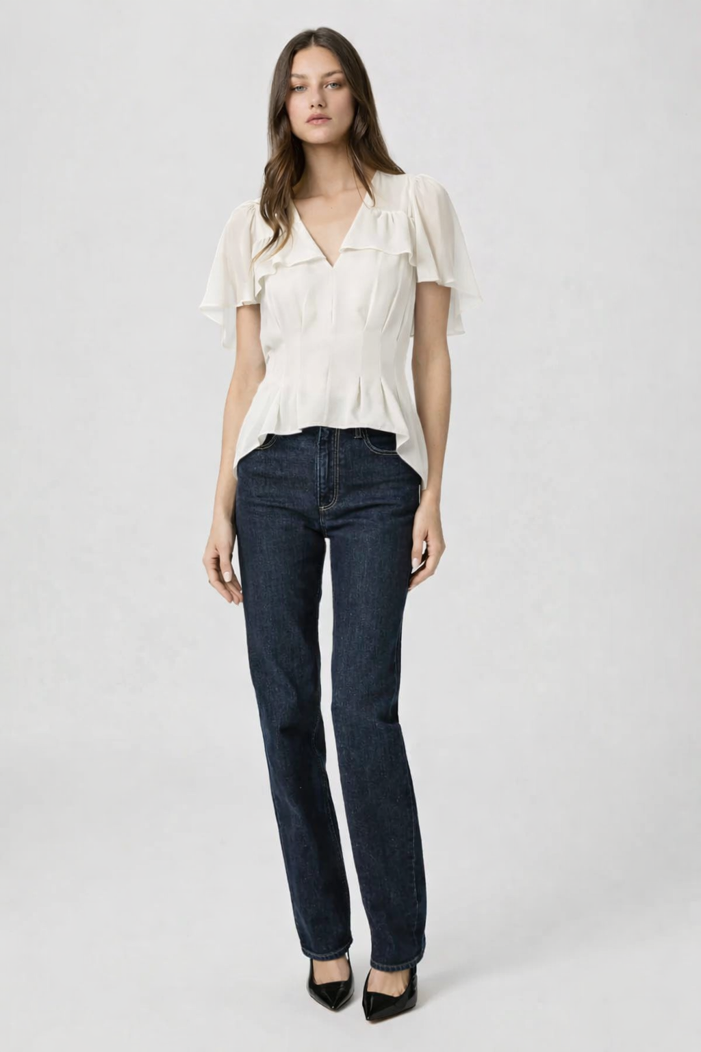 antique white short flutter sleeve blouse worn with dark denim from Paige