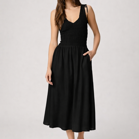Black dress with mid length skirt from paige