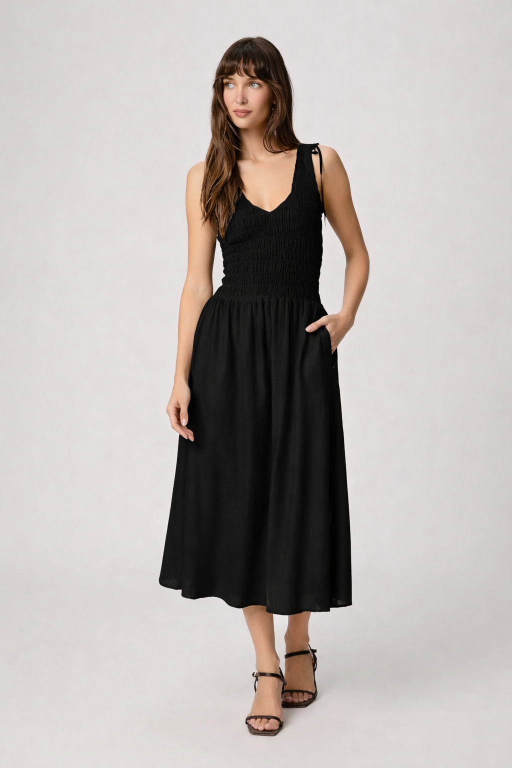 Black dress with mid length skirt from paige