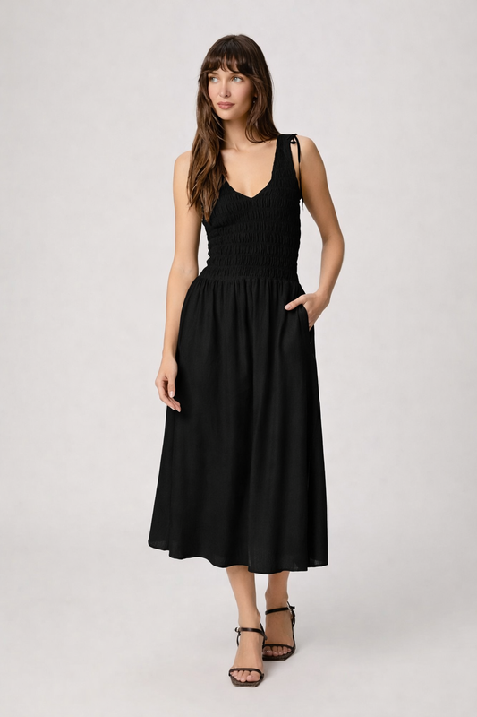 Black dress with mid length skirt from paige