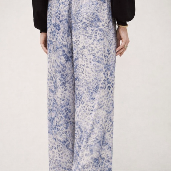 Rear view of silky blue animal print straight wide leg trousers from ba&sh