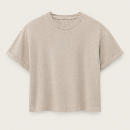 Cement coloured boxy t-shirt on a plain background