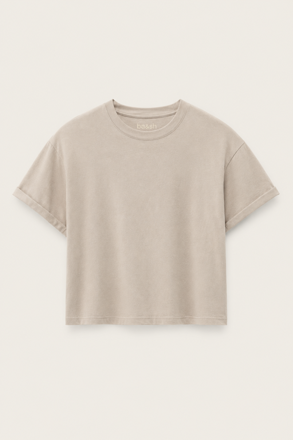 Cement coloured boxy t-shirt on a plain background