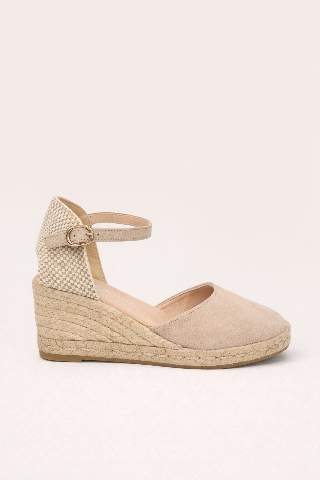 Beige wedge sandal with espadrille sole on a white background