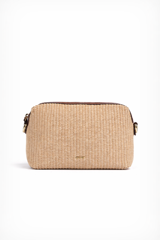 Beige woven handbag with gold hardware on a white background