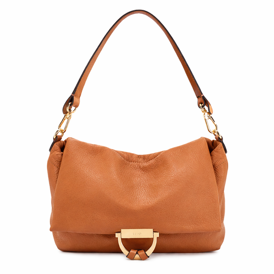 tan leather handbag with gold hardware on a white background 