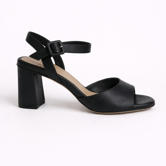 Black sandal with a block heel on a white background
