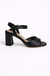 Black sandal with a block heel on a white background