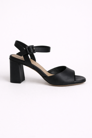 Black sandal with a block heel on a white background