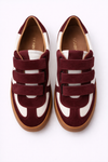 burgundy and white velcro trainer on a white background