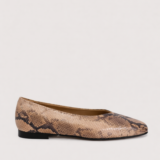 Snake print flat shoe on a light background