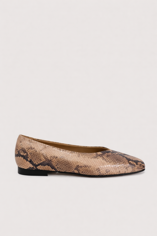 Snake print flat shoe on a light background