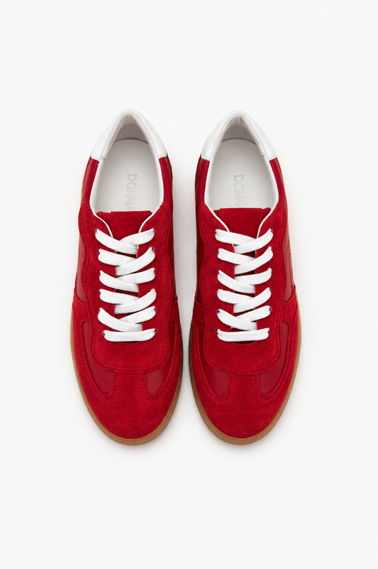 Red sneakers with white laces on a white background