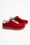 Red sneakers on a white background