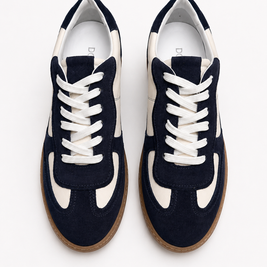 Navy blue sneakers with white laces on a white background