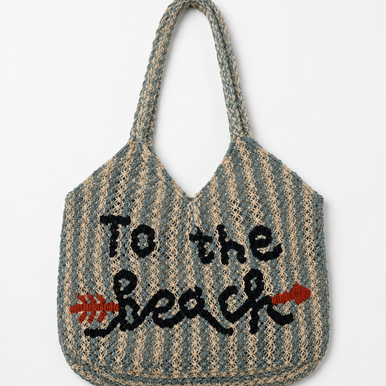 Striped tote bag with 'To the Beach' text on a white background