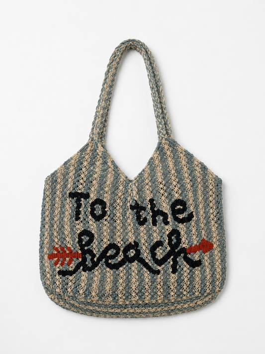 Striped tote bag with 'To the Beach' text on a white background