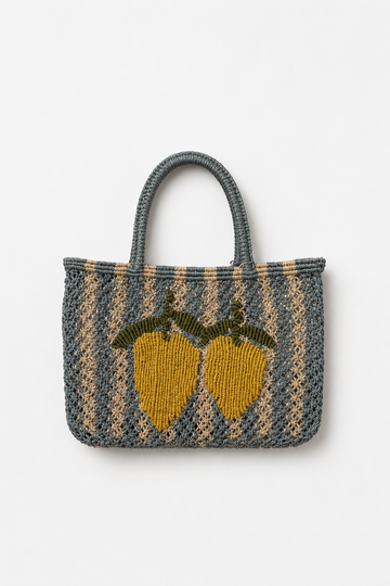 Woven bag with lemon design on a white background