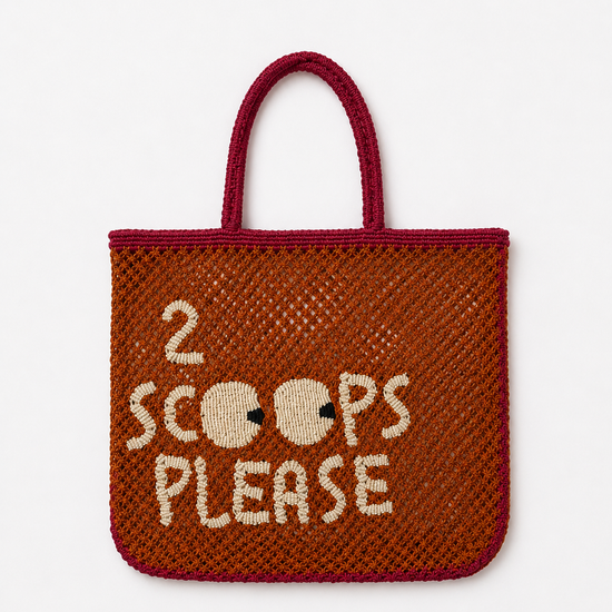 Woven bag with '2 Scoops Please' text on a white background