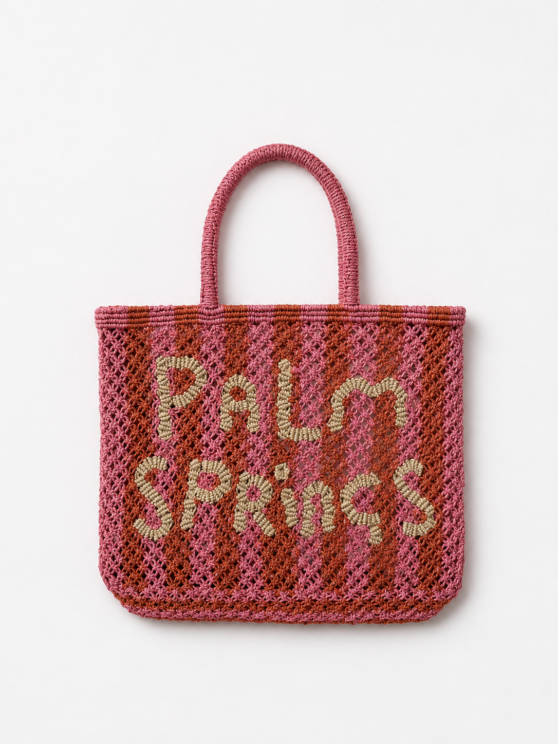 Pink and orange woven bag with 'Palm Springs' text on a white background