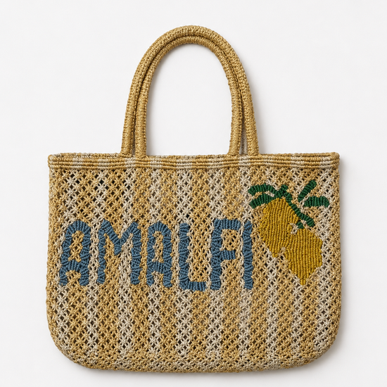 yellow and beige string bag with slogan on white background