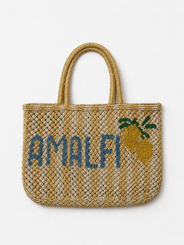 yellow and beige string bag with slogan on white background