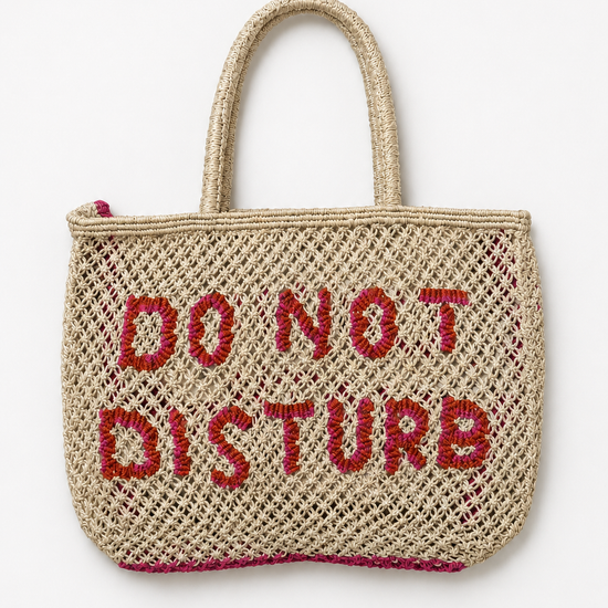 Woven bag with ink slogan on a white background